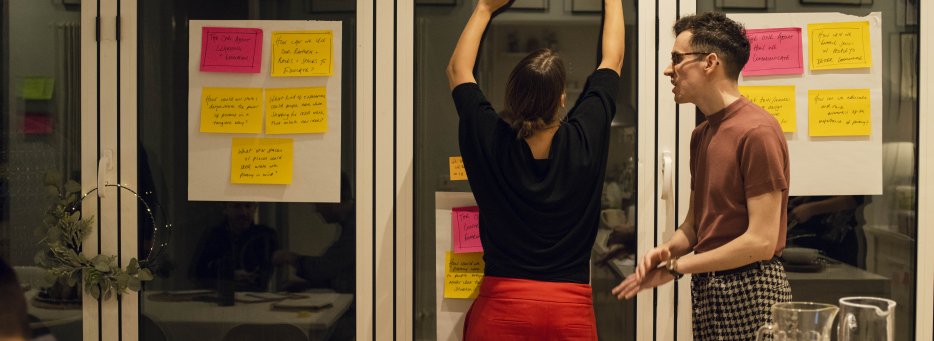 man-and-woman-brainstorming-with-postits