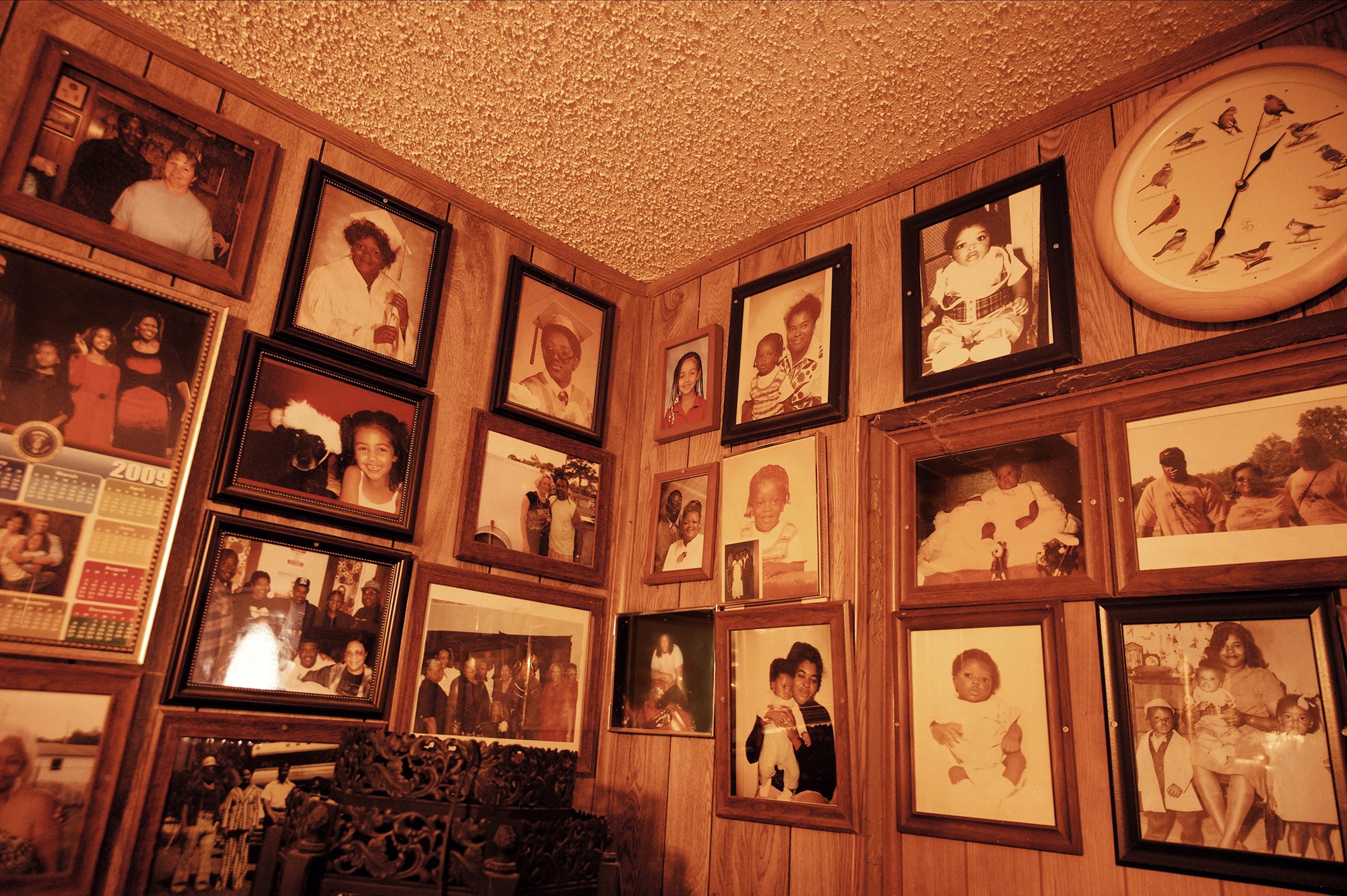 Walls covered with framed family photos.