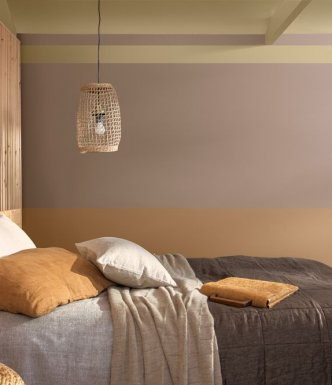 Bedroom with a cosy feel, with orange brown and neutral warm colours