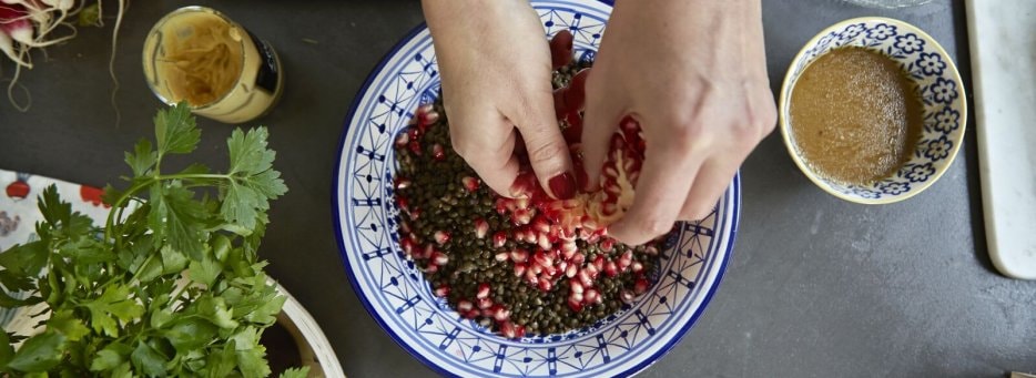 womanss-hands-mixing-food-in-bowl