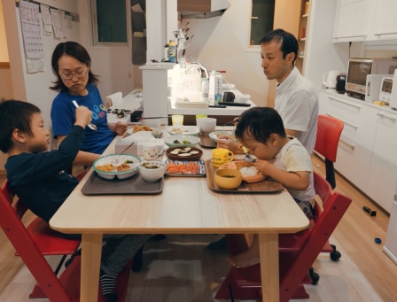 Family sitting at the table, eating dinner